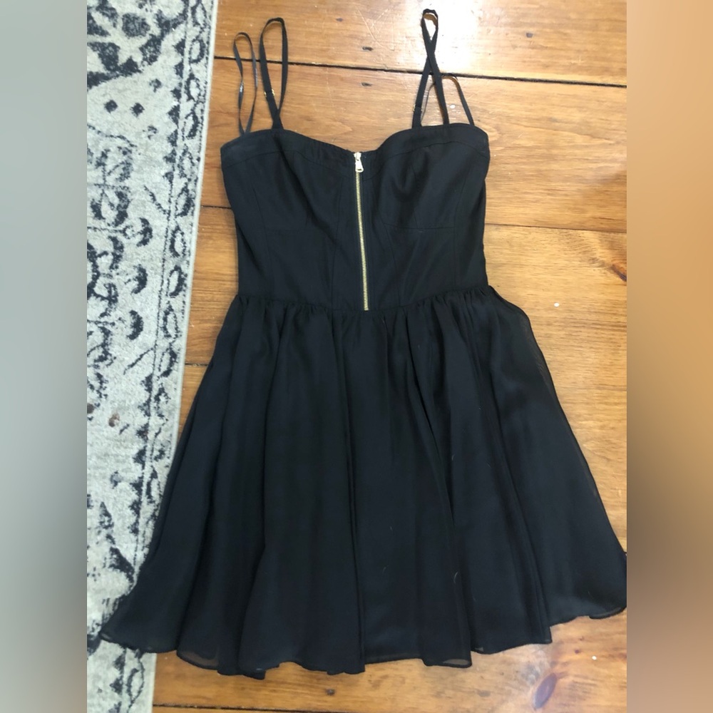 Guess black mini dress can be worn with straps or strapless.